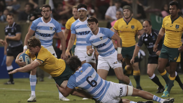Turnaround: Wallabies captain Michael Hooper reaches for the try line.