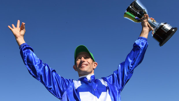 Star turn: Hugh Bowman salutes the crowd after his winning run in the Turnbull Stakes.