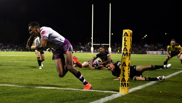 Josh Addo-Carr crosses for a Storm try in their humbling of the Panthers on Saturday. 
