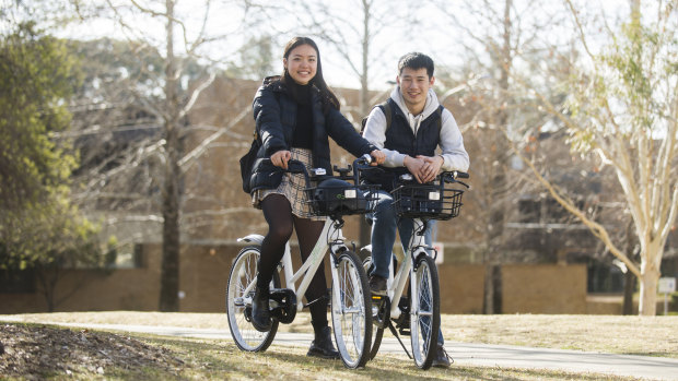 Lucy Xu and Michael Ma are some of the first users of Airbike in Canberra since it rolled out last week.