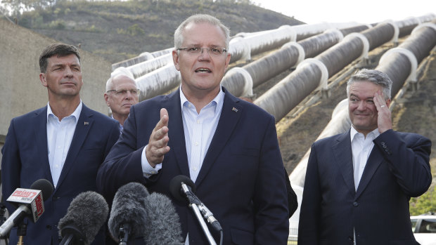 Minister for Energy Angus Taylor, Prime Minister Scott Morrison and Minister for Finance and the Public Service Mathias Cormann speak to the media during a visit to the Snowy Hyrdo Tumut 3 power station in Talbingo, NSW. 