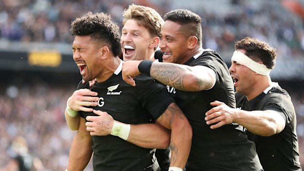 All Black Ardie Savea (left) celebrates scoring a try with Beauden Barrett and Shannon Frizell during the Bledisloe Cup match between the All Blacks and the Wallabies at Eden Park in Auckland last October. 