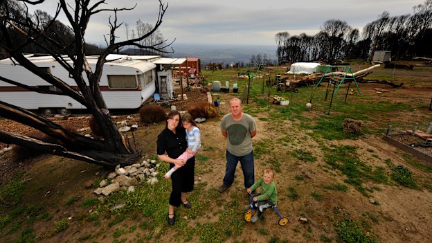 Shane and Bron Sparkes, with Lola and Dom, lived in a caravan on their property after the Black Saturday fires.