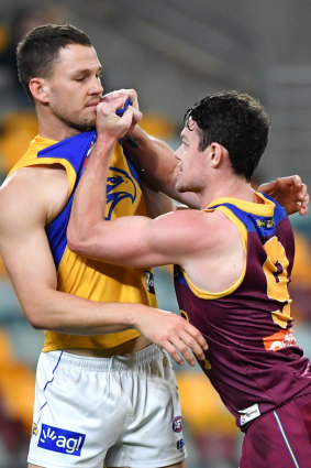Brisbane's Lachie Neale tangles with Eagle Jack Redden. 