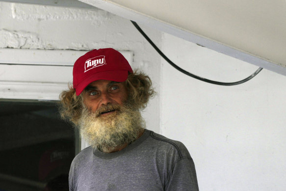 Australian Timothy Lyndsay Shaddock looks out from the tuna boat “Maria Delia” that rescued him and his dog Bella, as he arrives to port in Manzanillo, Mexico.