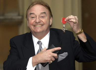  Gerry Marsden holds his MBE in 2003.
