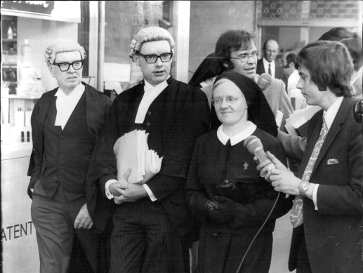 “Sister Mary Muirhead leaves the court with Mr Daniel Horton, who appeared for her with Mr. P. J. Kenny, QC.”