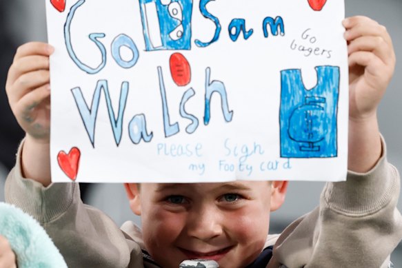 A young Blues fan shows his support for Sam Walsh.