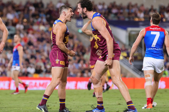 Dayrne Zorko and Darcy Fort celebrate a first-half goal.