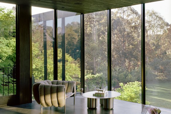 Perched on a river flood plain, it appears to float gently among the surrounding trees.