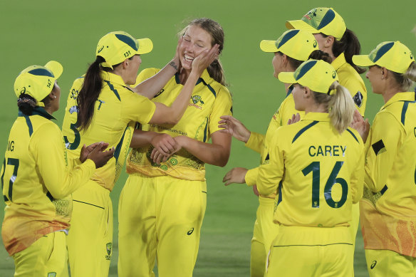 Megan Schutt congratulates Darcie Brown on one of her four World Cup wickets against England.
