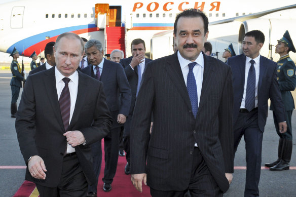 The former Prime Minister Karim Masimov, right, and the then Russian Prime Minister Vladimir Putin.