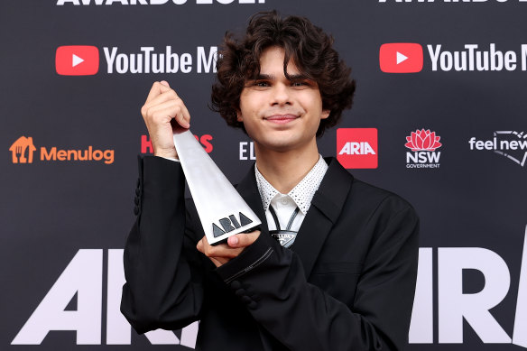 Budjerah poses with the ARIA Award for the Michael Gudinski Breakthrough Artist.