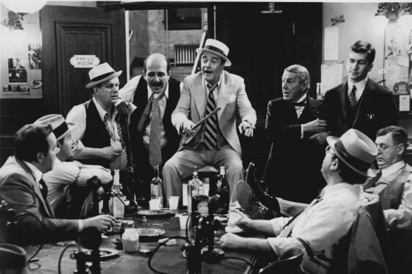 Columnists discussing who to blame next or Jack Lemmon as newspaper ace Hildy Johnson in <i>The Front Page</i>?