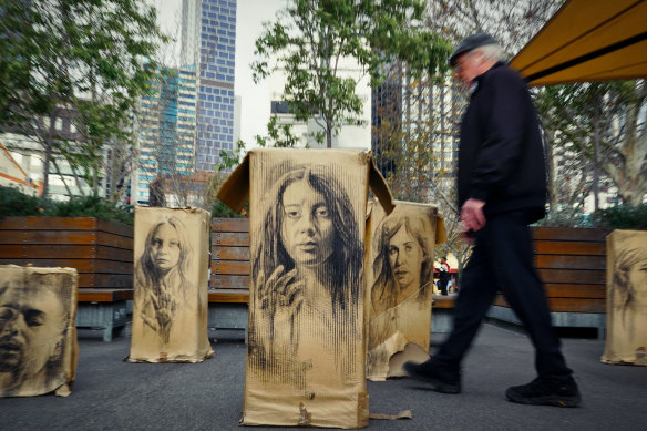 Shoppers walk past public art at the Queen Victoria Market in Melbourne’s CBD.