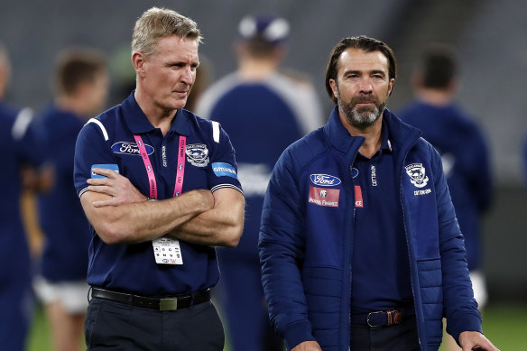 Geelong coach Chris Scott (right) and the club’s former football boss Simon Lloyd.