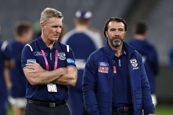Geelong coach Chris Scott (right) and football boss Simon Lloyd have the challenge of fixing the Cats’ slow start.
