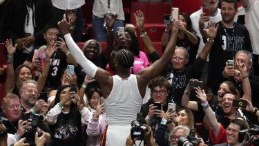 Wade waves to the crowd.