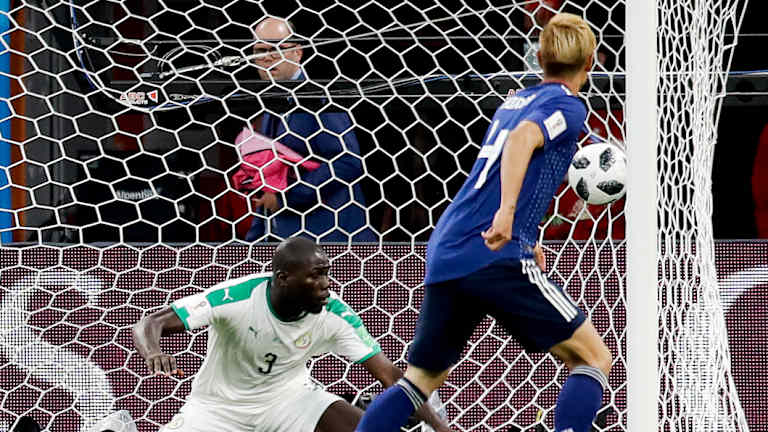 Japan's Keisuke Honda scores against Senegal in this year's World Cup.