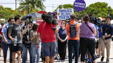 Democratic presidential candidate Amy Klobuchar is swarmed by the press during her visit at the Homestead Detention Center ahead of the first Democratic debates.