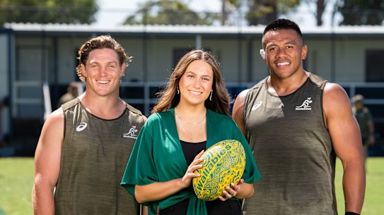 Wallabies captain Michael Hooper and prop Allan Alaalatoa with Olivia Fox, who will sing the Australian national anthem in the Eora language of the Gadigal people before the Wallabies play Argentina at Bankwest Stadium on Saturday.