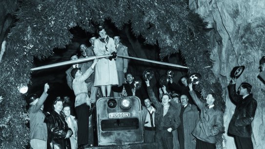 Lady Eileen Hudson cutting the ribbon to formally open the Guthega tunnel in 1954. 