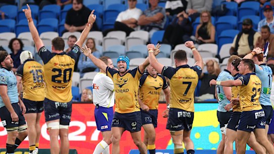 Western Power celebrate beating the Waratahs.