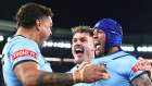 MELBOURNE, AUSTRALIA - JUNE 26: Brian To’o of the Blues celebrates scoring a try with Latrell Mitchell and Angus Crichton of the Blues during game two of the men’s State of Origin series between New South Wales Blues and Queensland Maroons at the Melbourne Cricket Ground on June 26, 2024 in Melbourne, Australia. (Photo by Quinn Rooney/Getty Images)