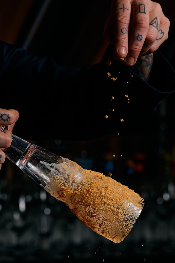 The “tropical sand storm” cocktail features an edible sand rim.