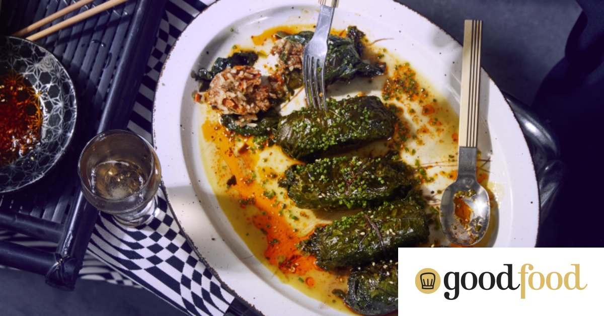 Kale rolls stuffed with spicy merguez sausage and rice