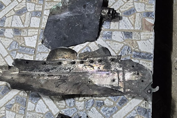 Fragments that Iranian media said came from a projectile used in a U.S. strike are laid out in Kuhestak, southern Iran