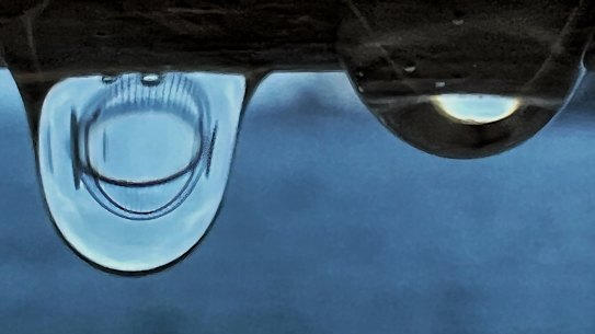 There has been cooler wet weather in Sydney after days of high temperatures and humidity.
Macro photo of a refracted image of the Sydney Harbour Bridge through a water drop.
taken on iPhone 13pro +
Photo Nick Moir 2 feb 2022