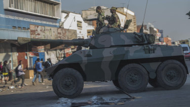 An army tank patrols on a street in Harare during protests by opposition party supporters on Wednesday.
