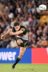 Nathan Cleary kicks a two-point field goal against Brisbane.