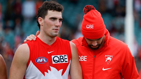 Tom McCartin (left) with older brother Paddy after the Anzac Day game in Launceston.