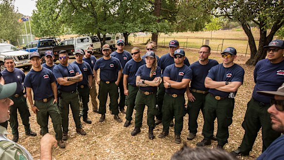 Firefighters from America being briefed by Deputy Incident Controller Jarrod Hayse at the Incident Control Center near Myrtleford on Friday.