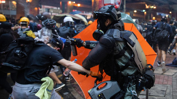 Riot police deploy pepper spray against demonstrators during a protest in the Admiralty district of Hong Kong in October.
