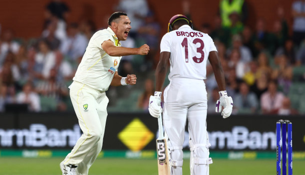 Scott Boland celebrates the wicket of Shamarh Brooks.