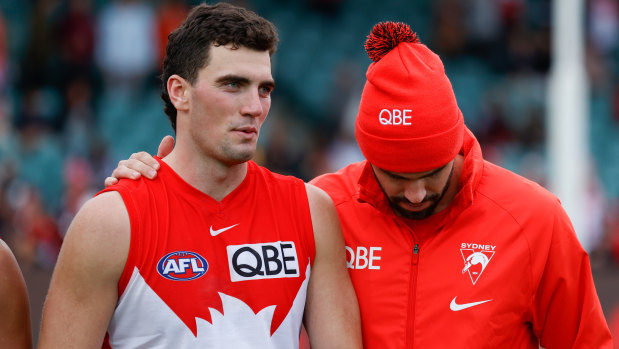 Tom McCartin (left) with older brother Paddy after the Anzac Day game in Launceston.