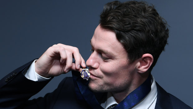 Ultimate honour: Lachie Neale poses with the Brownlow Medal.