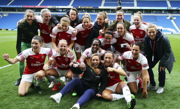 Arsenal players celebrate winning the FA Women's Super League at AMEX Stadium in Brighton on Sunday.