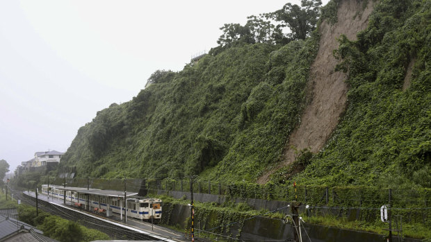 A landslide due to heavy rain is seen nearby a train station in Kagoshima City, south west of Japan. 