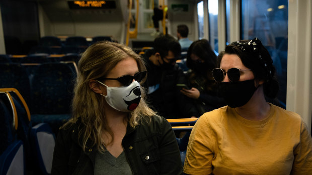 The NSW government is under increasing pressure to make masks mandatory on public transport.
