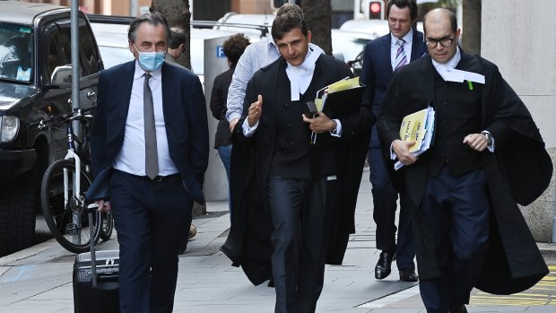 Arthur Moses, SC, (centre) the barrister for Ben Roberts-Smith arrives at the Federal Court.