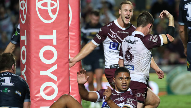 Backing up: Maroons and Manly skipper Daly Cherry-Evans congratulates Cade Cust on a try against the Cowboys.