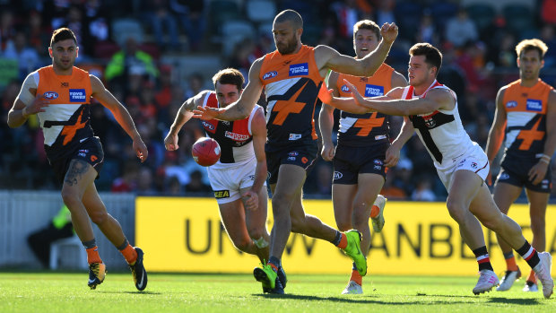 Sam Reid  clears the ball for the Giants in Canberra.