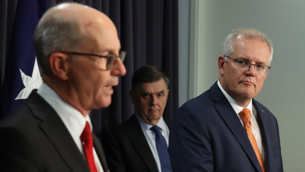Chief Medical Officer Paul Kelly with Prime Minister Scott Morrison and Health Department chief Brendan Murphy announcing the AstraZeneca vaccine pause for under-50s on Thursday.