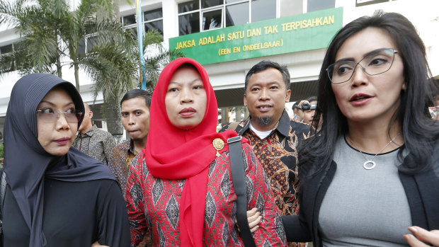 Baiq Nuril Maknun, centre, arrives at the Attorney-General's office in Jakarta, Indonesia, earlier this month.