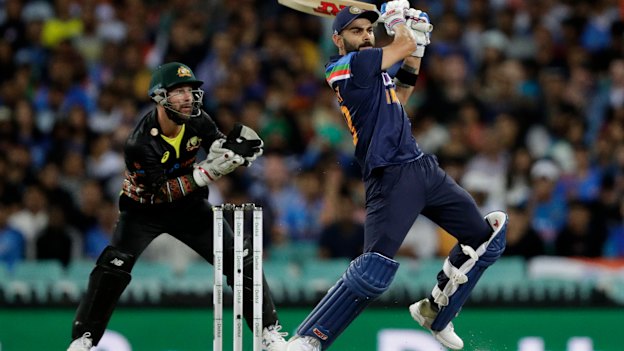 Earl Eddings says one day we will wonder how we managed to get India to Australia for a full series. Pictured is Indian captain Virat Kohli and Australian counterpart Matt Wade in the T20 this week at the SCG.