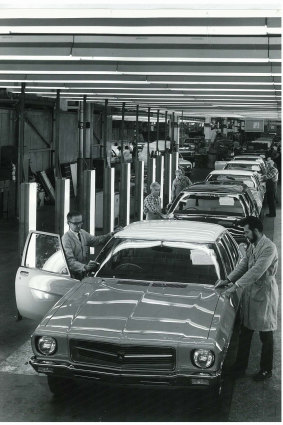 Inspectors check Holdens coming off the assembly line at the GMH Dandenong plant, 1974.